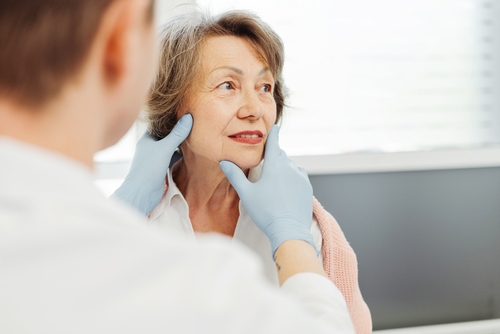 Attractive,Senior,Woman,,Patient,Talking,To,Cosmetologist,Doctor,,He,Touches